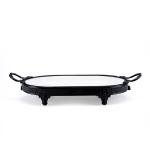 Oval serving tray with a matte black iron base
