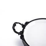 Oval serving tray with a matte black iron base
