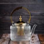 Luxury undulating glass teapot with gold accents and wooden handle